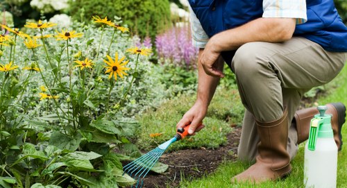 Gardener wearing PPE and checking tools before starting work