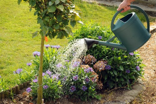 Garden maintenance crew handling green waste for recycling